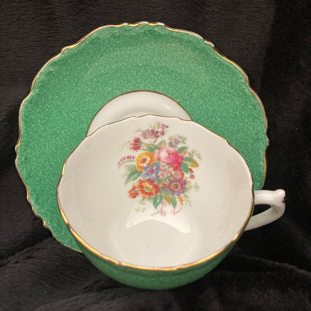 A Coalport bone china teacup and saucer, pattern 9507.